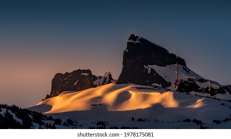 Early morning Sunrise over the  famous Black Tusk and the smaller Bishop's Mitre peak, a hiking destination in the Garibaldi Mountain Range near Whistler, British Columbia, Canada