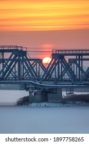 Early Morning Sunrise With A Railway Bridge In The Foreground. Industrial Scene