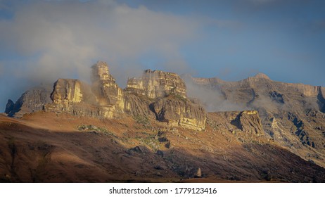 Early Morning View Of The Drakensberg Mountains With Light Snow 