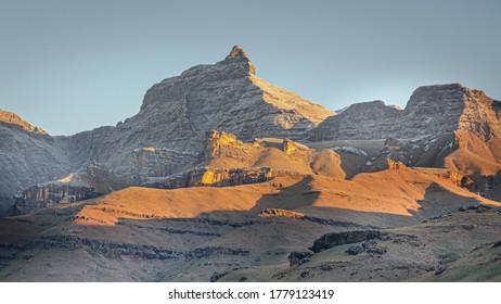 Early Morning View Of The Drakensberg Mountains With Light Snow 