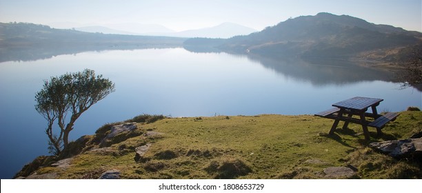 An Early Morning Wide View Of A Picnic Bench At The Side Of Annascaul Lake  A Popular Tourist Attraction In This Area Of Dingle Peninsula.