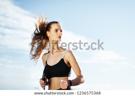 Similar – Fit healthy athletic woman jogging on a river bank