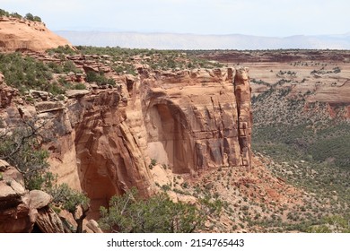 Early Sandstone Arches Forming In The Desert Plateau