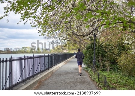 Early spring Jogging in central park NYC 