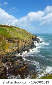 Early summer afternoon sunshine after a storm at the Lizard Lighthouse on the cliffs at Lizard Point in the Lizard Peninsula, Cornwall, UK