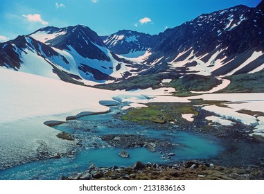 Early Summer Snow In A High Mountain Pass At Crow Pass In Alaska