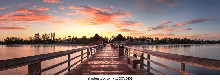 Early Sunrise Over The Naples Pier On The Gulf Coast Of Naples, Florida In Summer.