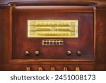 Early twentieth century wooden tube radio with illuminated display