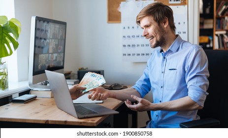 Earn money from home. Best Online jobs. Work from home on the internet. Man working on laptop and earning plenty of money. Successful male business man getting euro from laptop. Happy professional.