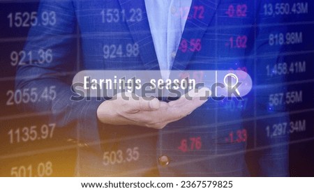 Earnings season, hand holding with written in search bar with the financial data visible on background, Reports Stock Market Ticker