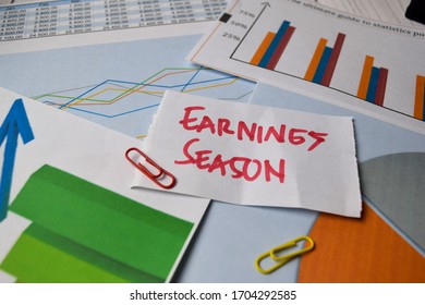 Earnings Season Write On Sticky Notes Isolated On Office Desk. Stock Market Concept