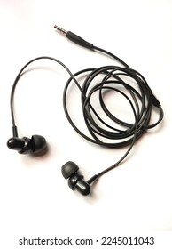 earphones are a pair of small loudspeakers that are used very close to the ear - Shutterstock ID 2245011043