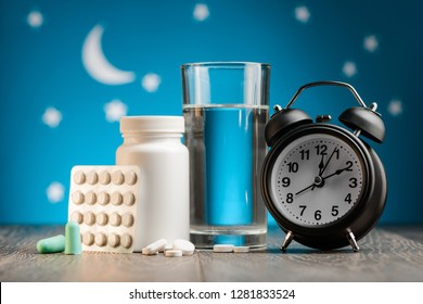 Earplugs, Pills And Clock Against Starry Sky. No More Sleepless Nights, Medical Aids And Bedtime Accessories.