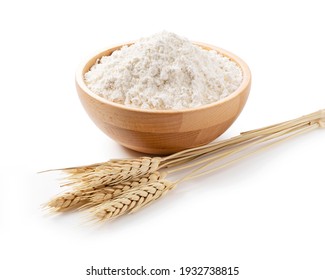 Ears of wheat and flour in a wooden bowl on a white background. Close-up, Material Photo - Shutterstock ID 1932738815