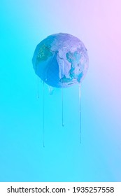 Earth Ball Hovers Melts And Leaks On Pastel Blue-purple-pink Holographic, Gradient, Neon Light Background. Minimal Concept Of Global Warming, Natural Disaster, Melting, Pollution Or Climate Change.