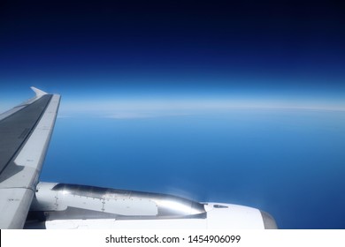 Earth Curvature Seen From Aircraft Window At High Altitude