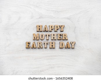 Earth Day  Beautiful greeting card  Isolated background  close  up  view from above  wooden surface  Congratulations for relatives  friends   colleagues
