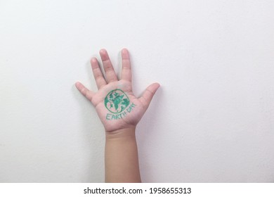 Earth Day Concept. Drawings Of Earth Day In The Hands Of A Kids. Kids Hand