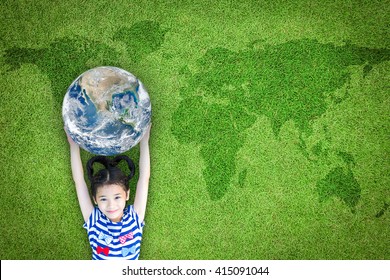 Earth Day, Ecological Friendly And Corporate Social Responsibility, CSR With People, Go Green And Sustainable Environment Concept With Kid Raising World On Lawn: Element Of The Image Furnished By NASA