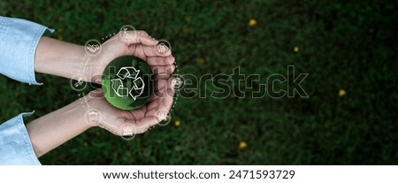 Earth Day,renewable,Energy,sustainable,Environment,Reuse,Reduce,Recycle Ecosystem,Zero waste,net zero,CSR,ESG concept.Green earth ball in hand and Recycle Sustainable sign in green bokeh background.