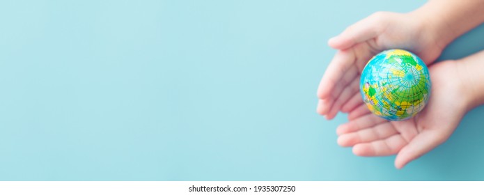 Earth Day.World Environment Day.Kid Hands Holding Earth Globe Blue Banner Background.CSR.Big Data Research, Discovery, Planet, Go Green, Earth During Coronavirus, Hope, Vaccine.Climate Change.human.