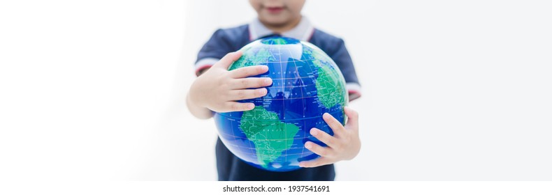 Earth Day.World Environment Day.Kid Hands Holding Earth Globe Blue Banner Background.CSR.Big Data Research, ESG,World Kid Day, Go Green, Earth During Coronavirus, Hope, Vaccine.Climate Change.human.