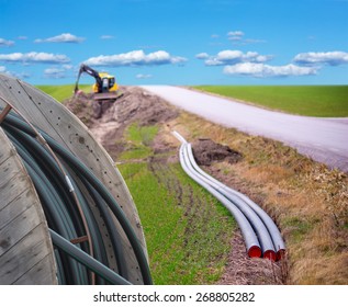 Earth Digger Used To Dig Down Cables For Broadband Connection In Rural Area