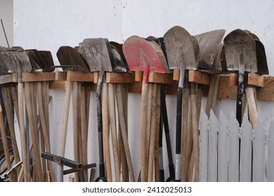 Earth digging tools, trowels and shovels. Photo of a deposit without people. Agriculture Tools.