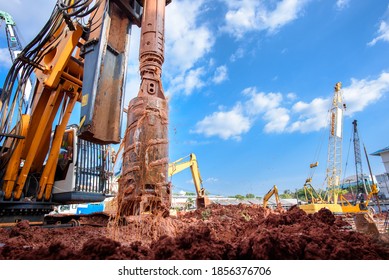 Earth drilling machine or hydraulic boring machine into a construction site for drilling piles.