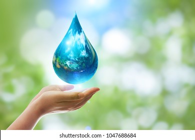 Earth In Drop Shape From On Two Hand.Elements Of This Image Furnished By NASA. United Nations Climate Change Conference.World Day For Water