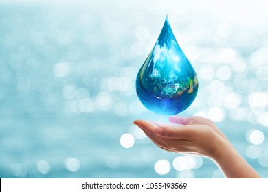 earth in drop shape from on two hand.Elements of this image furnished by NASA. United Nations Climate Change Conference.World Day for Water