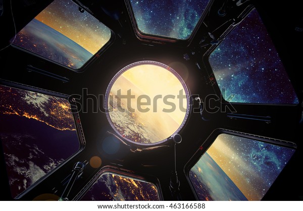 Earth and galaxy in spaceship window\
porthole. Elements of this image furnished by\
NASA.