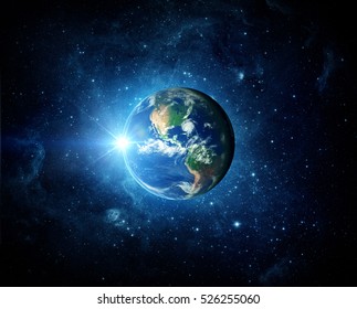 Earth, galaxy and sun. Elements of this image furnished by NASA. - Shutterstock ID 526255060