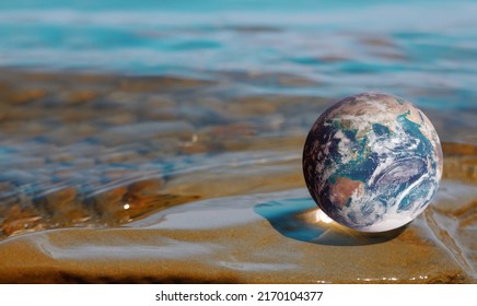 Earth Globe Against Seascape Background Composite Image. Protecting Our Planet And Oceans Concept. Space For Text. Blue Marble Earth Image Courtesy Of NASA