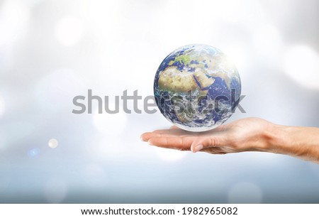 Earth globe in doctor's hands. World environment day concept.