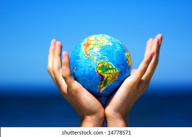 Earth Globe In Hands Protected. Ideal For Earth Protection Concepts, Recycling, World Issues, Enviroment Themes