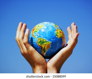 Earth Globe In Hands Protected. Ideal For Earth Protection Concepts, Recycling, World Issues, Enviroment Themes