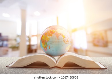 Earth Globe Model Ball On Open Book