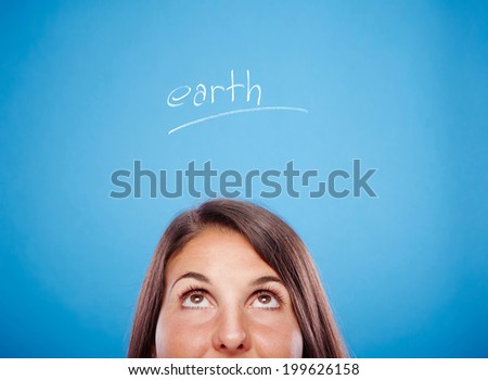 Earth! Earth hand drawn on a blue background with portrait of a young female. Stock photo © 
