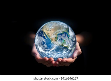 earth in hands. green planet on hand. save of earth. environment concept for background web or world guardian organization.Elements of this image furnished by NASA - Shutterstock ID 1416246167