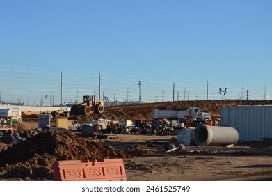 earth moving equipment at construction site of a new Intel semiconductor wafer manufacturing plant Arizona - Powered by Shutterstock