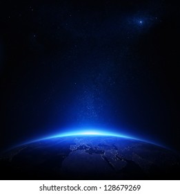 Земля ночью с городскими огнями (Элементы этого изображения, предоставленные НАСА)