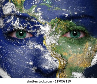 Earth painted on woman face. Elements of this image furnished by NASA