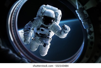 Earth Planet And Astronaut In Space Ship Window Porthole. Elements Of This Image Furnished By NASA