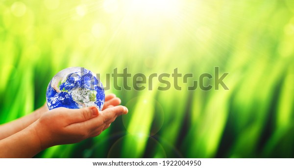 Earth planet in child hands. \
Save and\
protection Earth. Concept of the Environment World Earth Day: \
Elements of this image are furnished by\
NASA\
