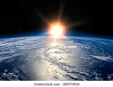 Earth with the rising sun. Elements of this image furnished by NASA