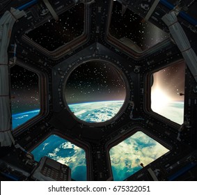 Earth Sunrise View Through The Window Of A Space Ship. 