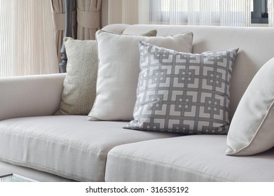 Earth Tone Sofa Set With Varies Pattern Pillows In Living Room