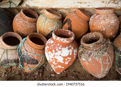 earthenware pots tied together with string to use for fishing and catching octopus