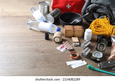 Earthquake Supply Kit On Wooden Table. Space For Text